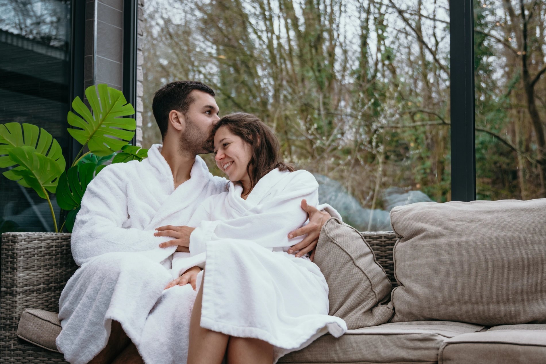 Bright and elegant indoor swimming pool with a view to the outside at Martin's Château du Lac.