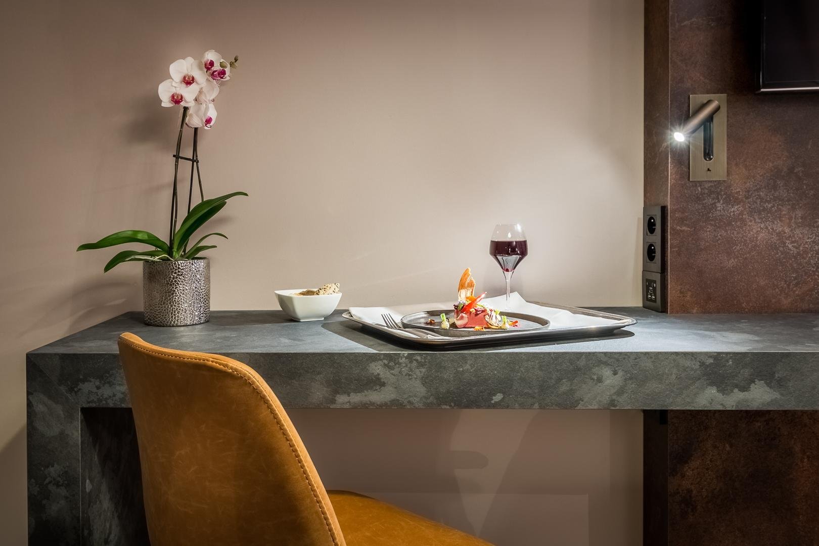 Dining corner with elegant decor and yellow chair in a room