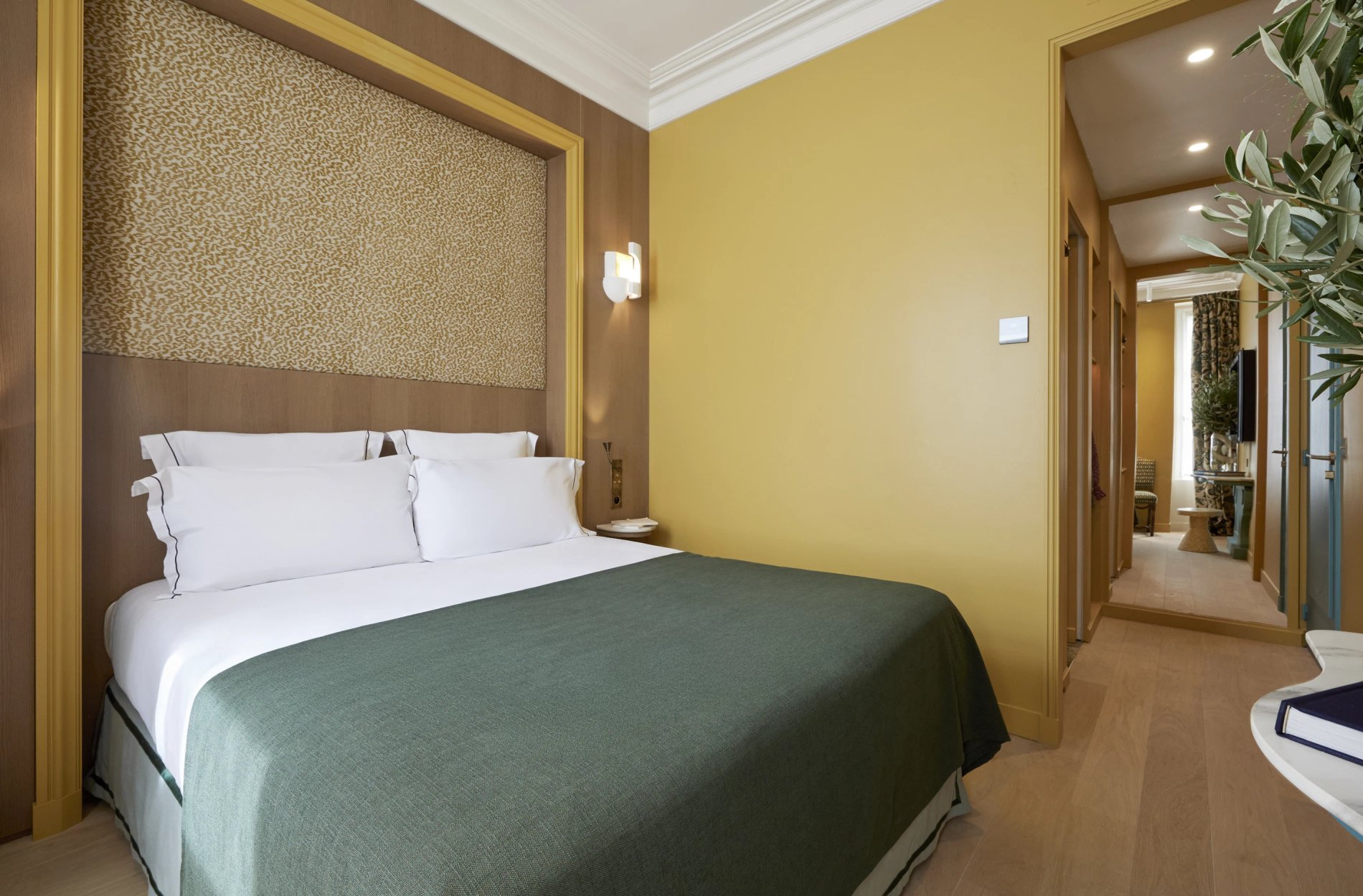 Elegant room with refined decor at Hôtel Prince de Conti, double bed with designer headboard