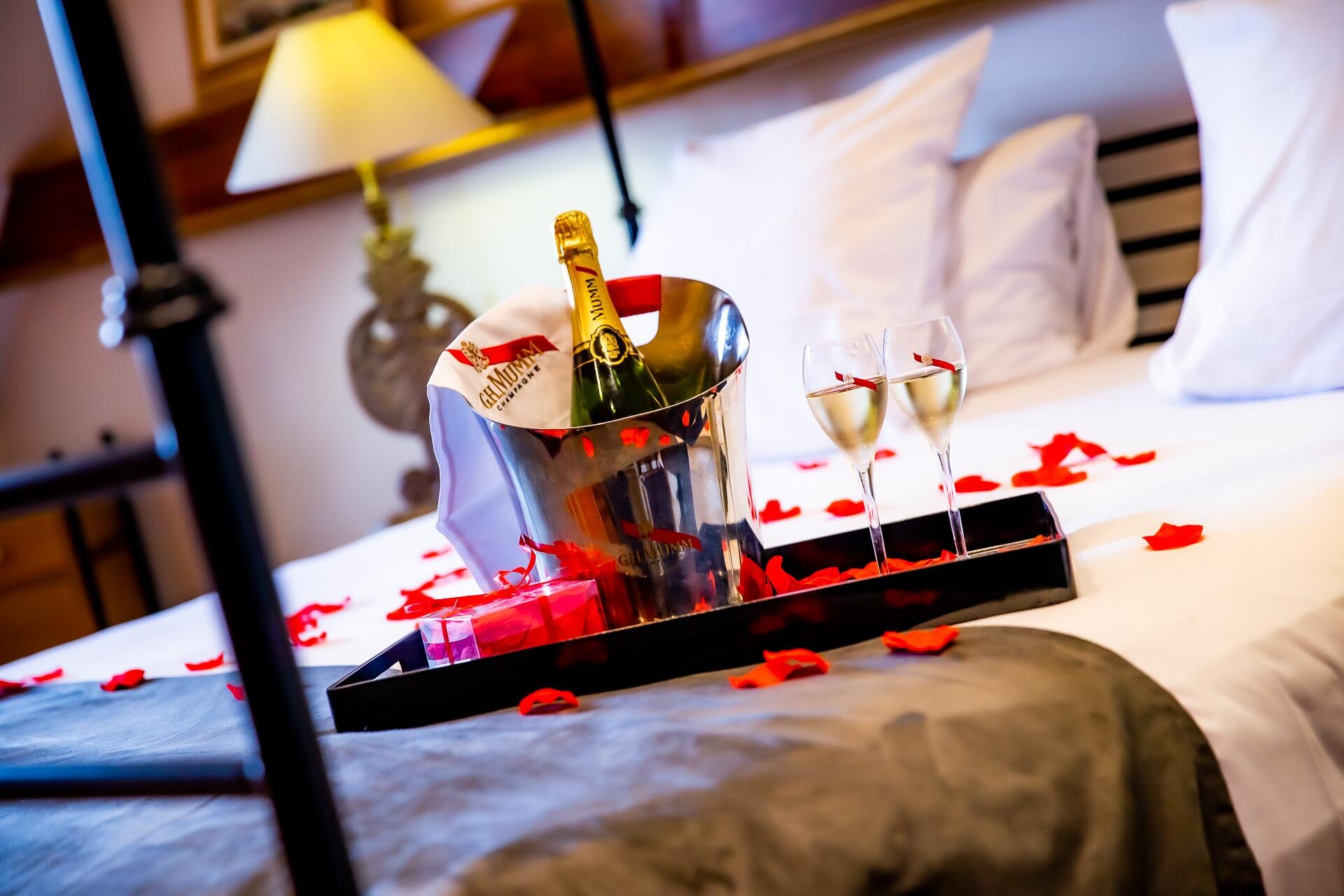 Glamor offer with champagne and rose petals