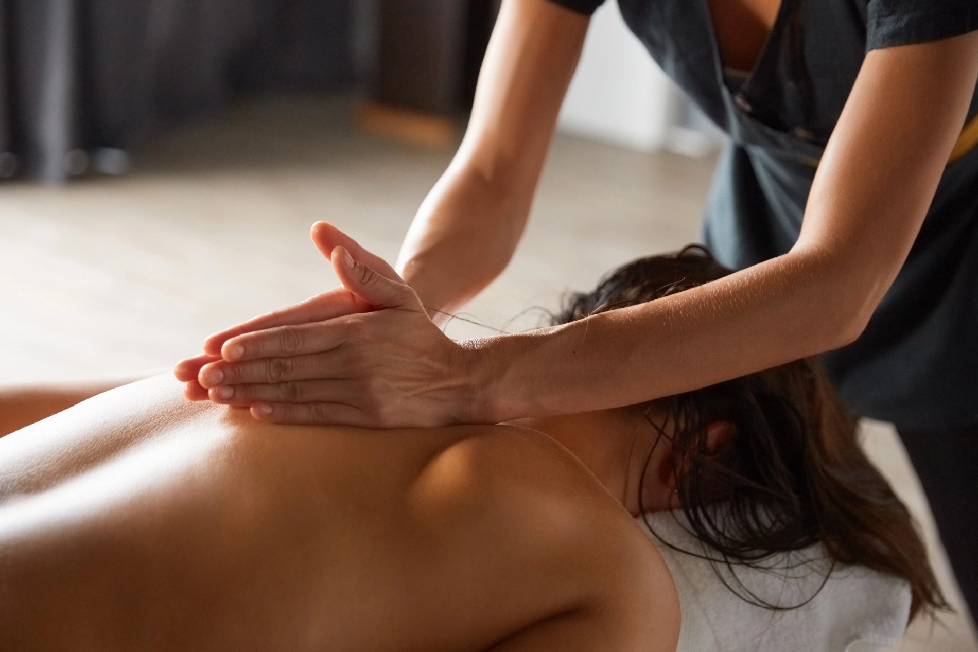 Relaxing massage session at the spa of Martin's Château du Lac hotel.