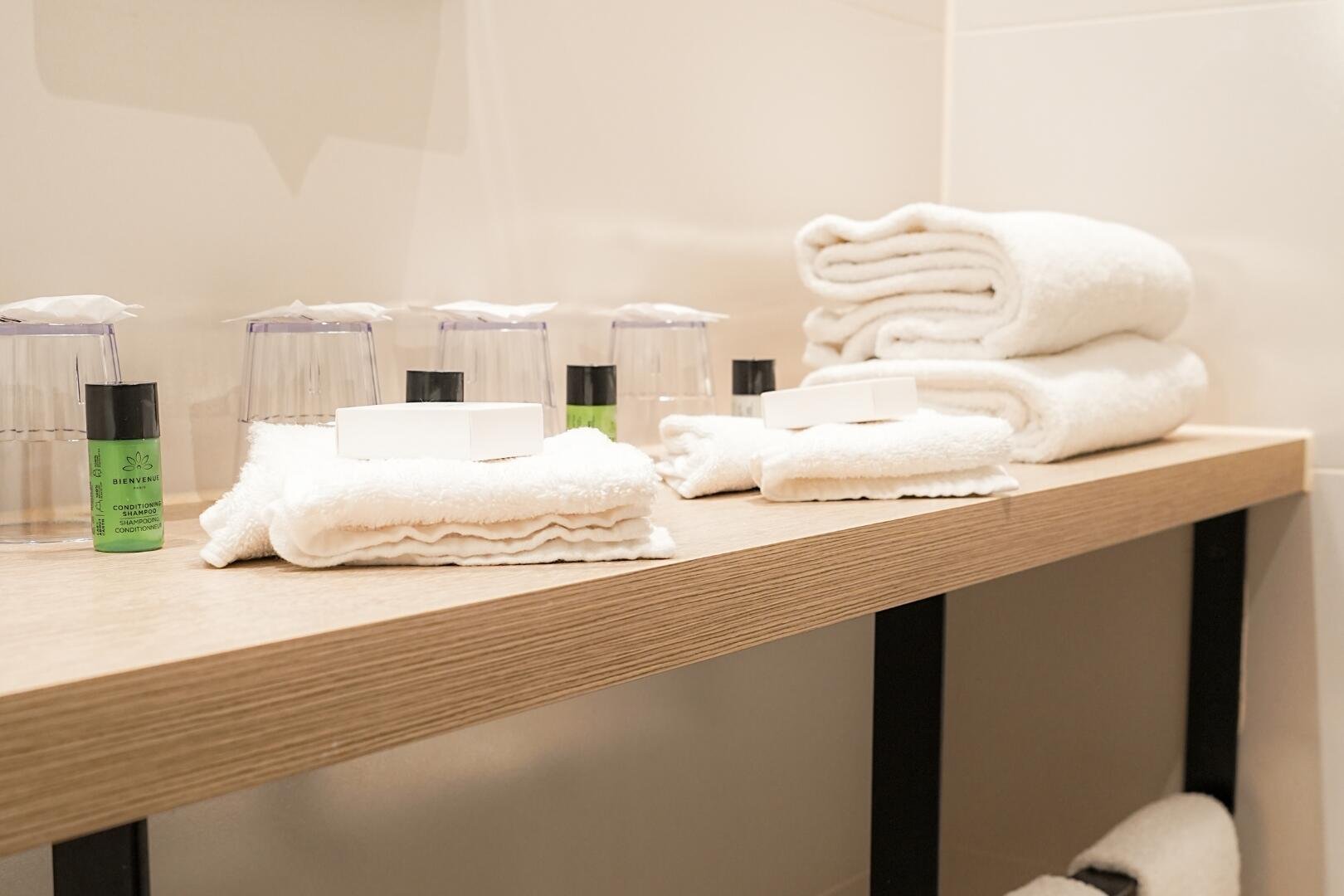 Close-up of a hotel bathroom with elegant toiletries