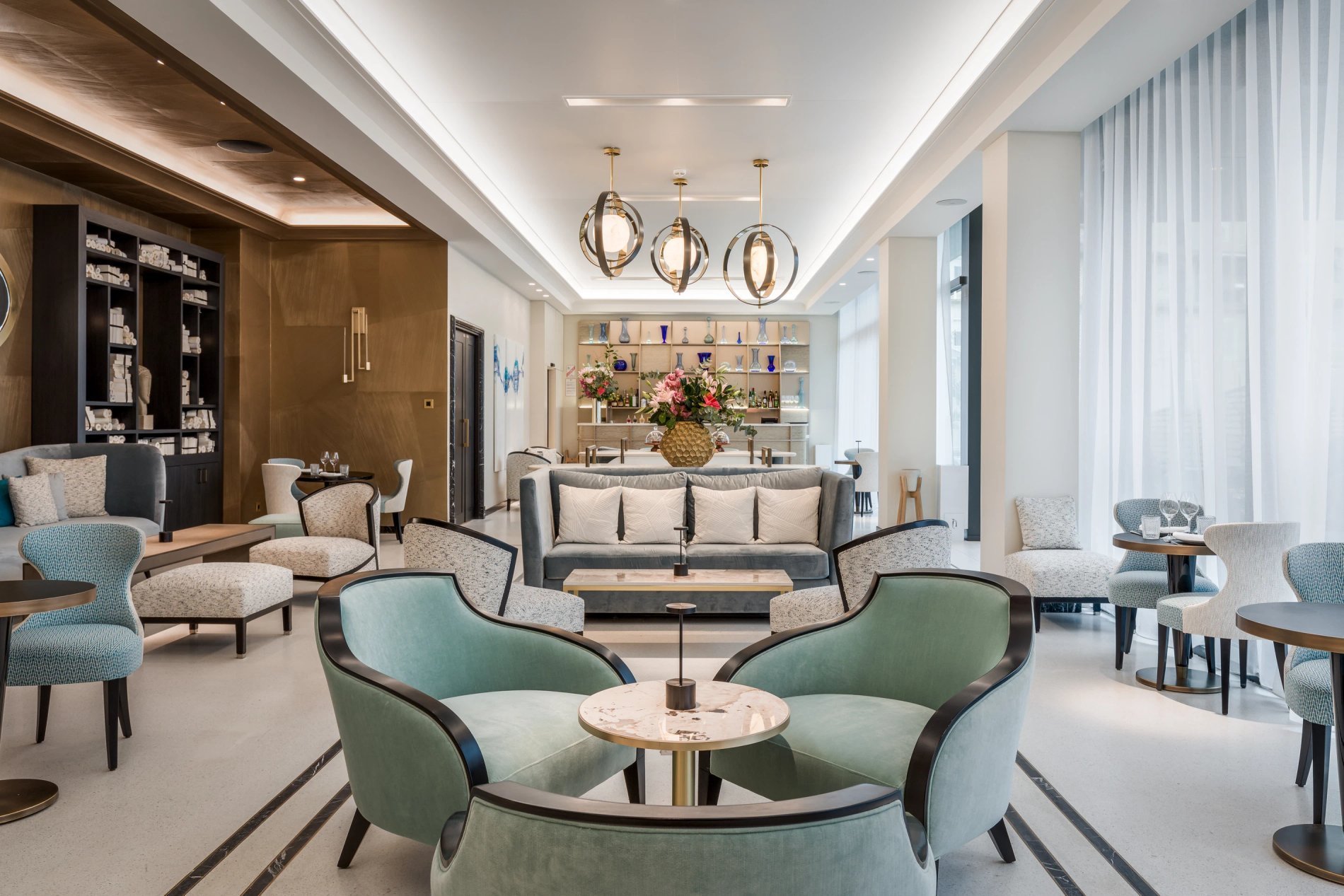 Comfortable lounge with table and seating at Café Victoria.
