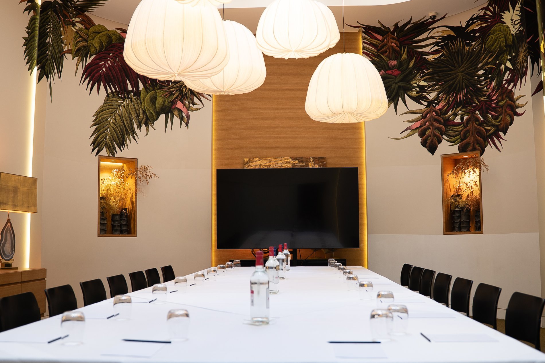 Hôtel Marignan meeting room with large set table and presentation screen