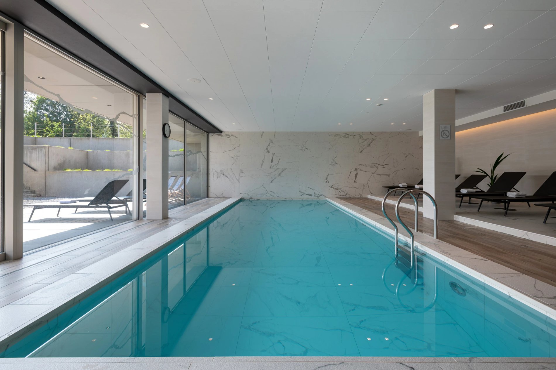 Bright indoor pool at the spa of Martin's Rentmeesterij hotel.