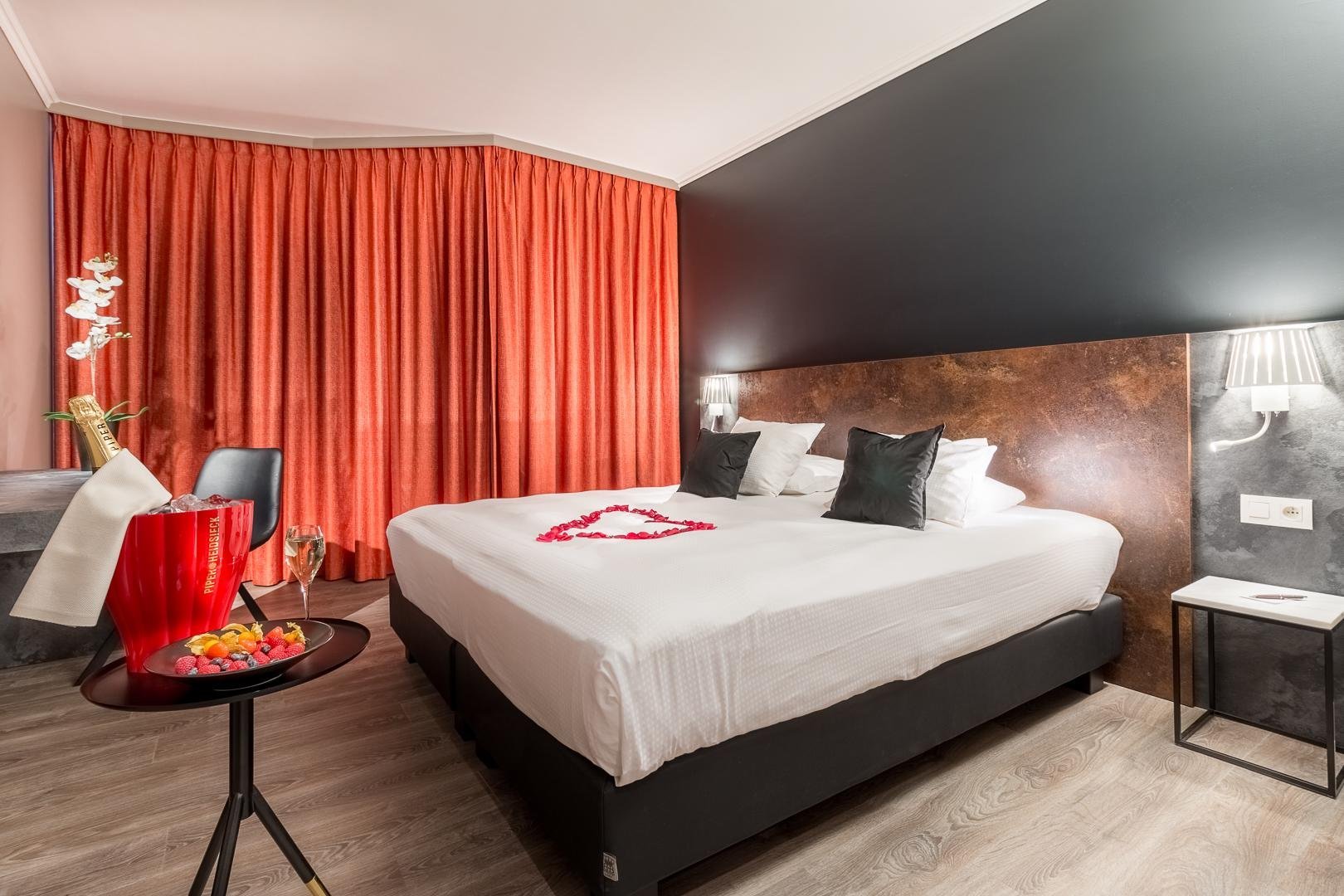 Modern room with red curtains and ambient lighting