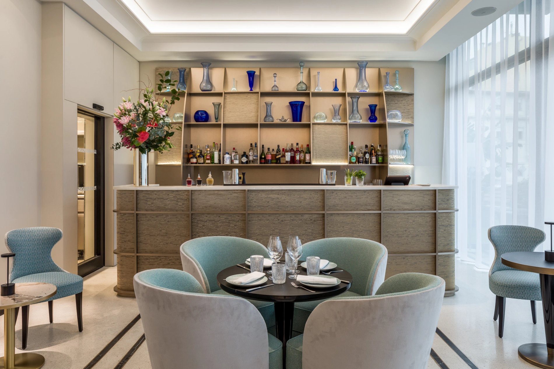 Comfortable lounge with table and seating at Café Victoria.