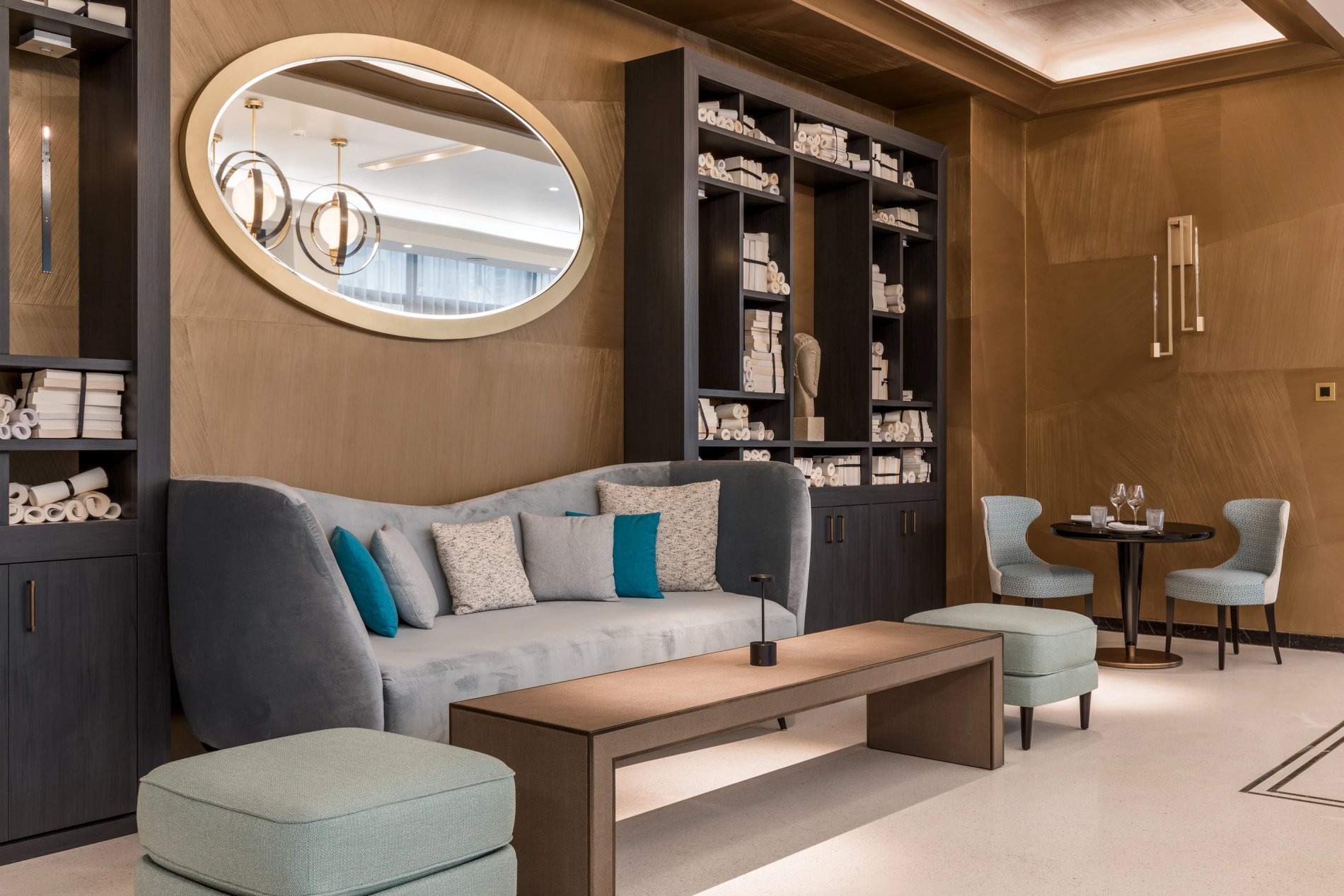 Comfortable lounge with table and seating at Café Victoria.