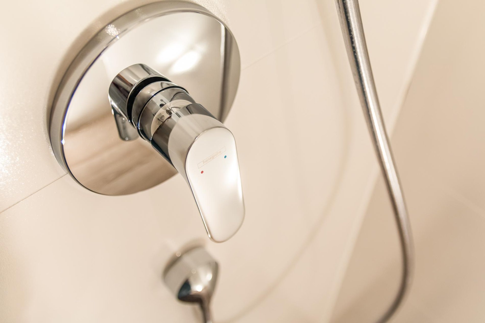 Modern bathroom in a Charming Quadruple room at Martin's Red, with sink and lighted mirror.
