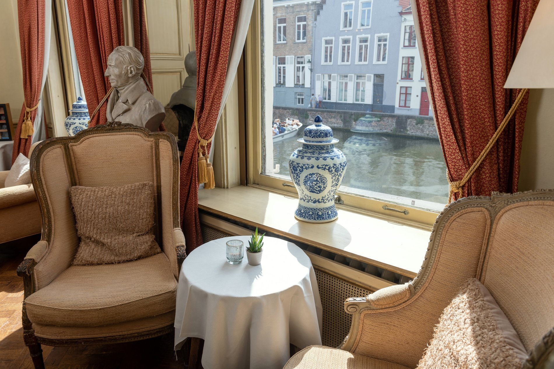 Picturesque view of Bruges canals from the bar at Martin’s Relais Hotel.