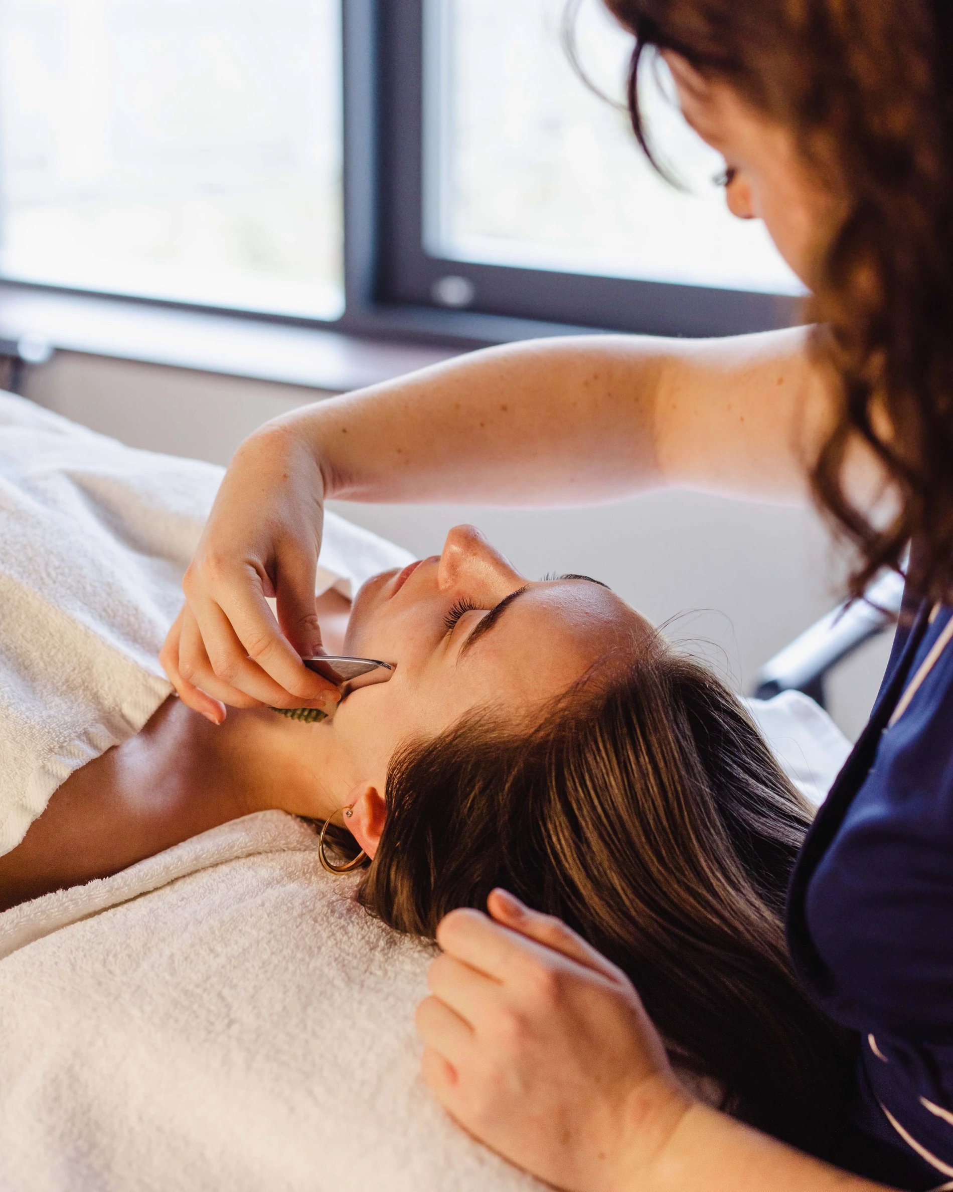 Relaxing facial massage in a spa in Belgium.