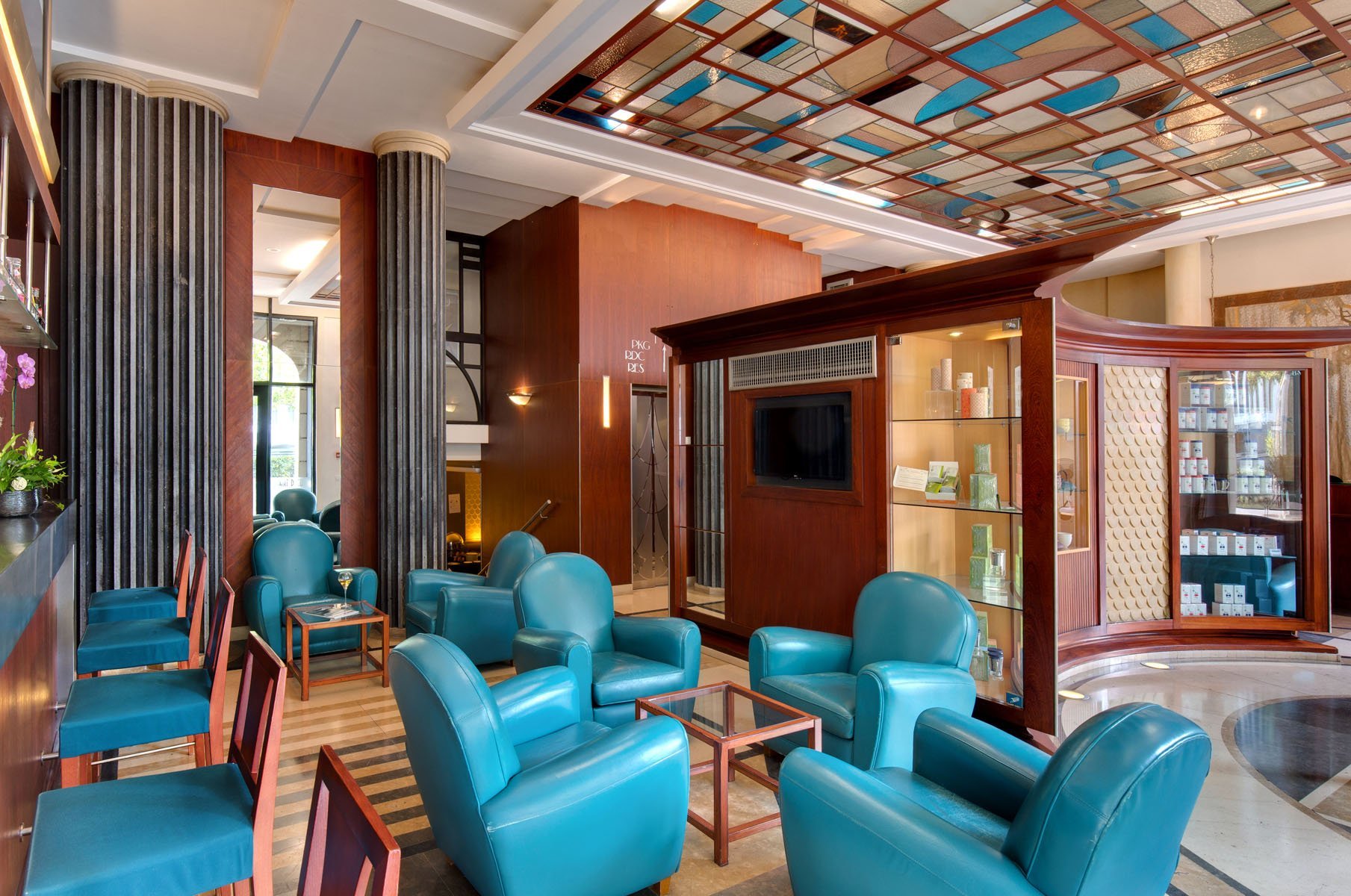 Art Deco lounge in the Art Deco Euralille hotel with designer armchairs and coloured ceiling