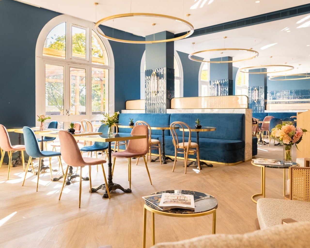 Bright dining room of the restaurant at VOCO Paris Montparnasse with comfortable tables and chairs.