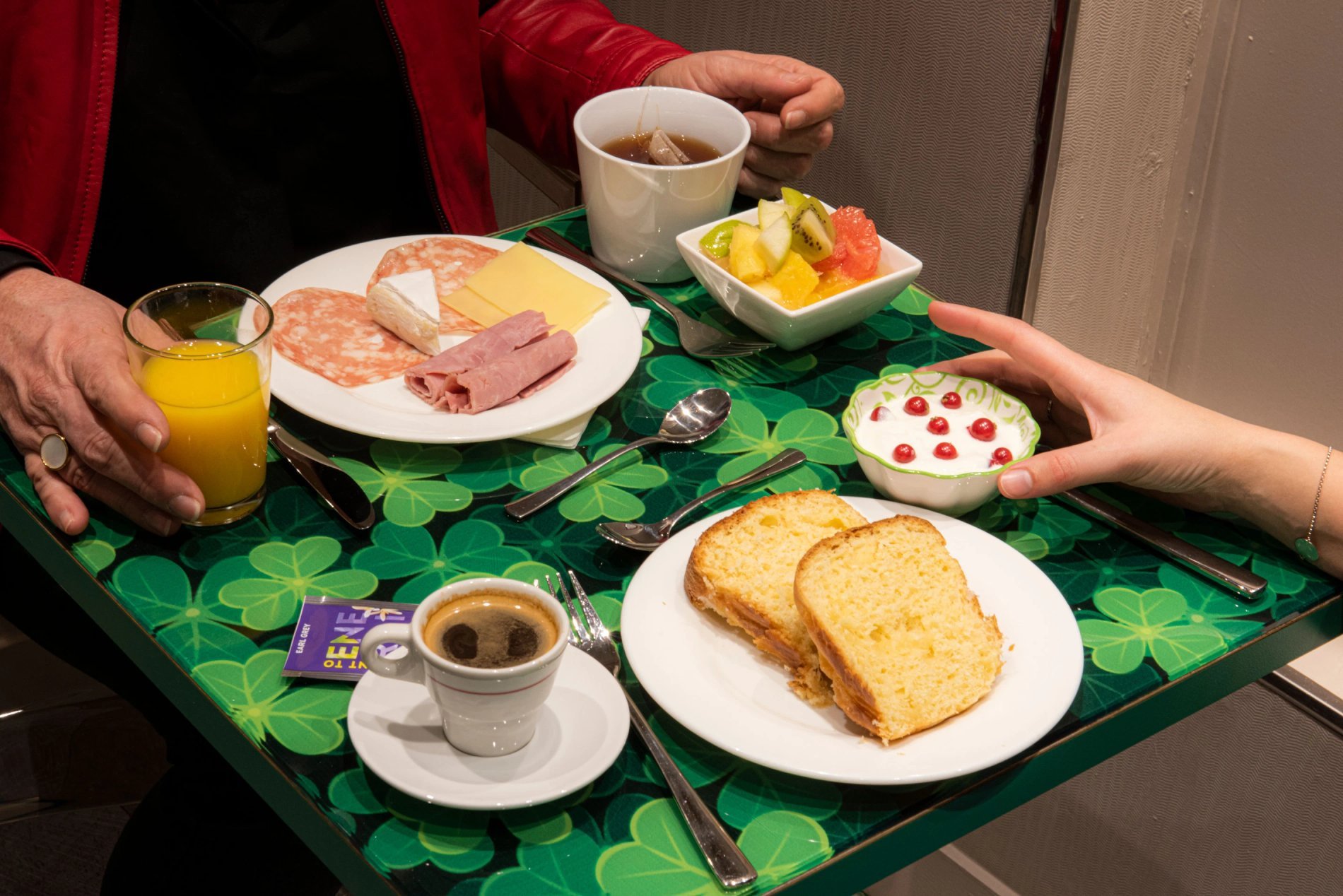 french breakfast : coffee, juice, brioche, ham, cheese,fruits