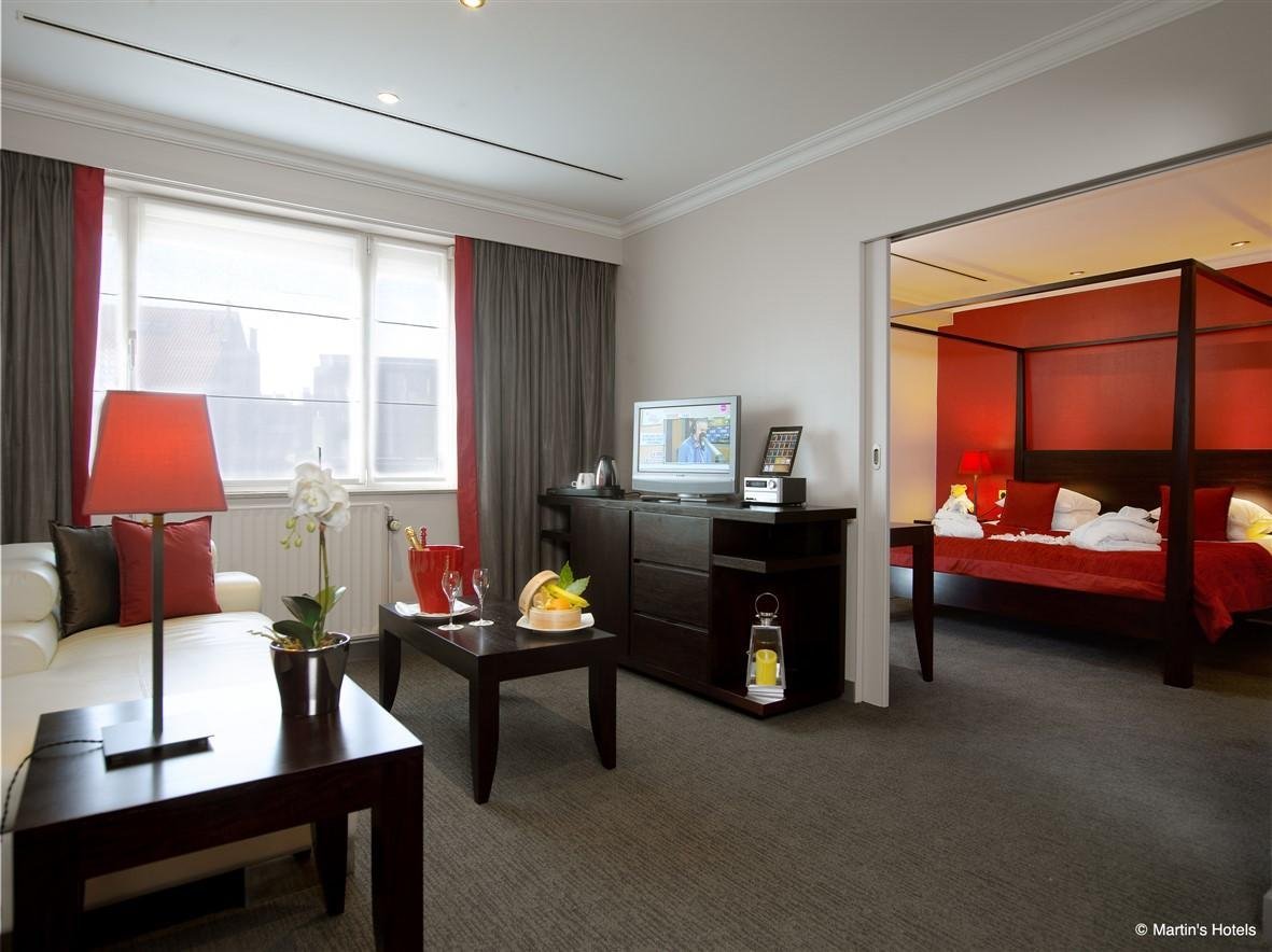 Spacious suite with a sitting area and modern decor