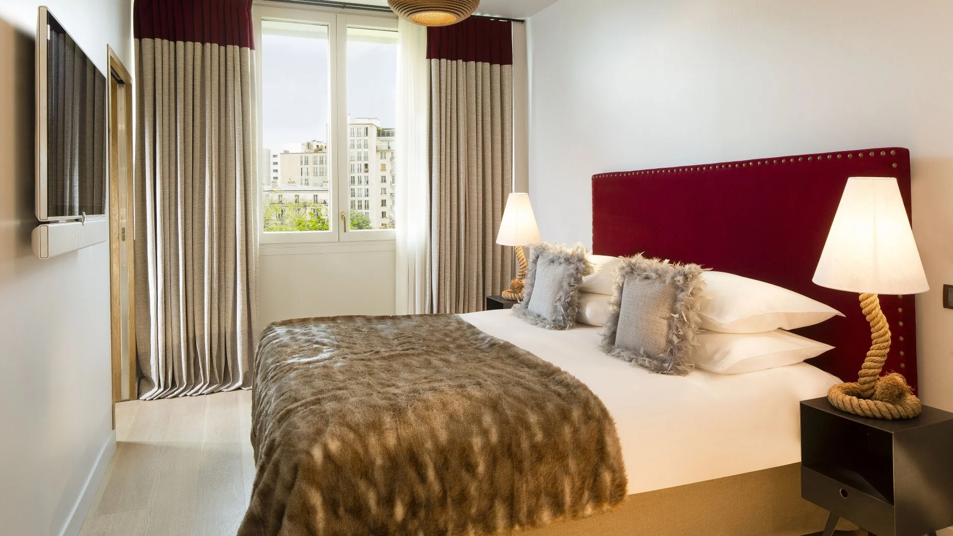 Goralska Résidences - Chambre élégante d'une suite, reflétant le confort de notre Hôtel Marais Paris.