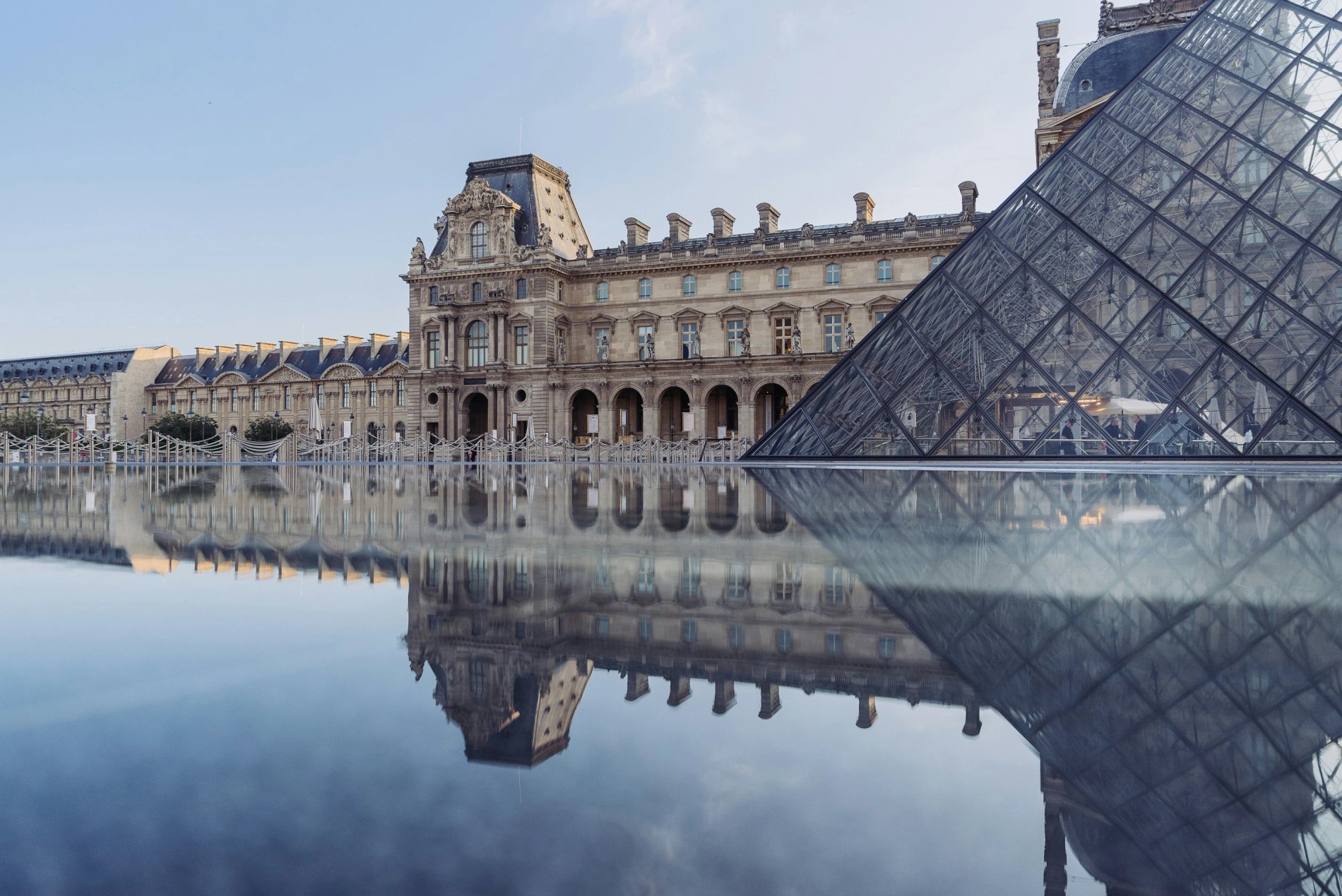 Louvre museum façade and pyramid near Hôtel Prince de Conti