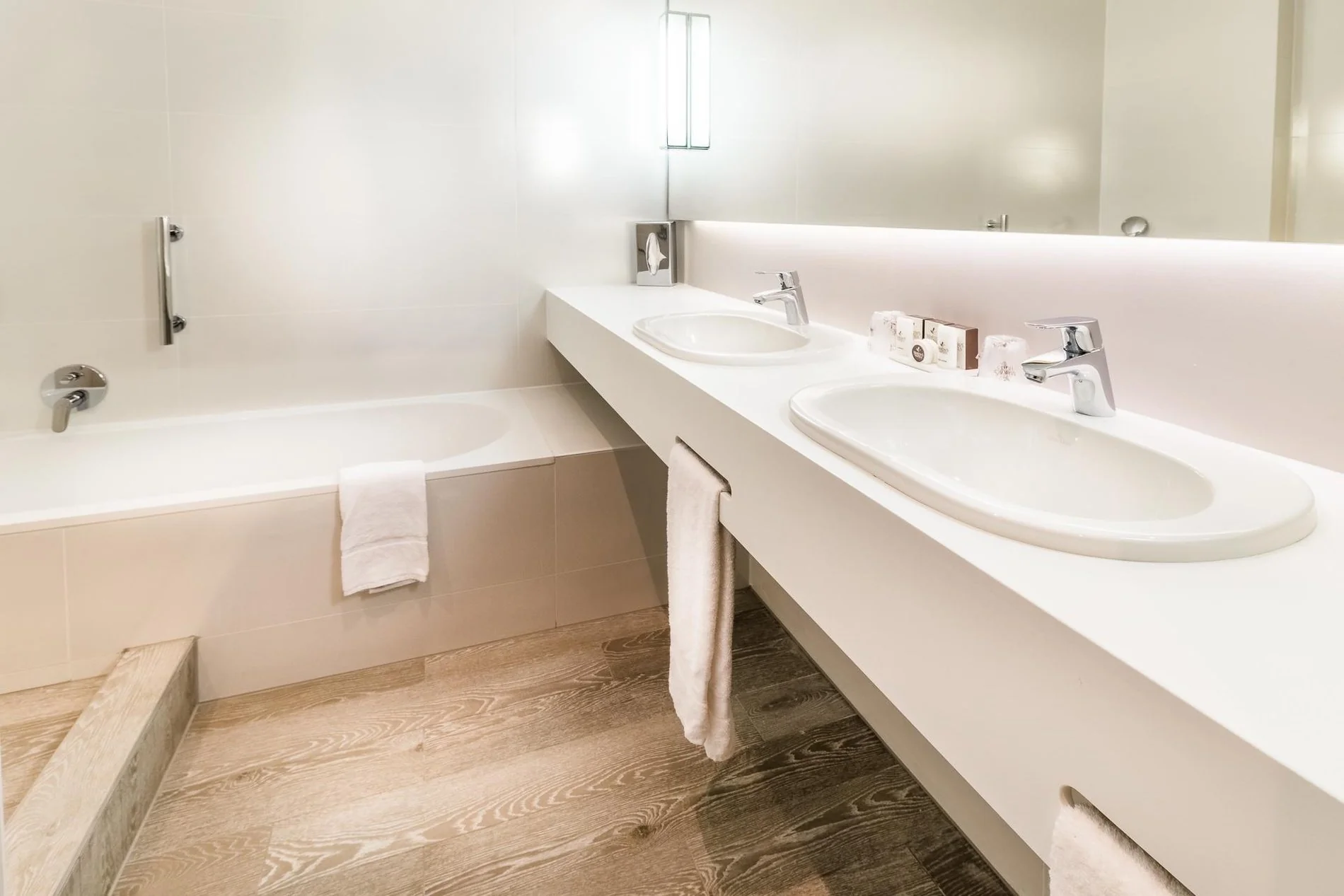 Modern bathroom at Martin's Red with a stylish sink, mirror, and toiletries.