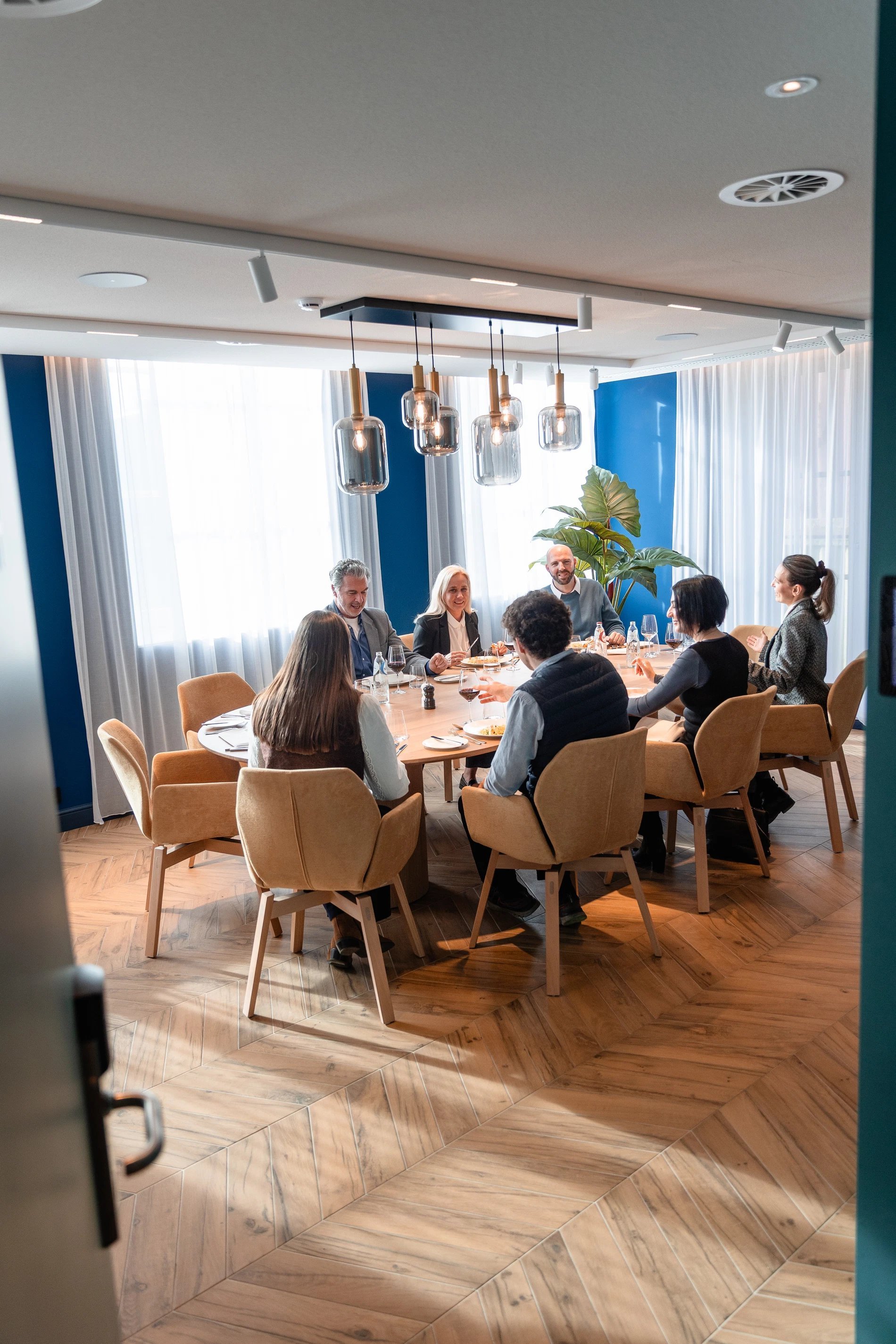 Elegant and modern restaurant with set tables at Martin's Klooster in Leuven.