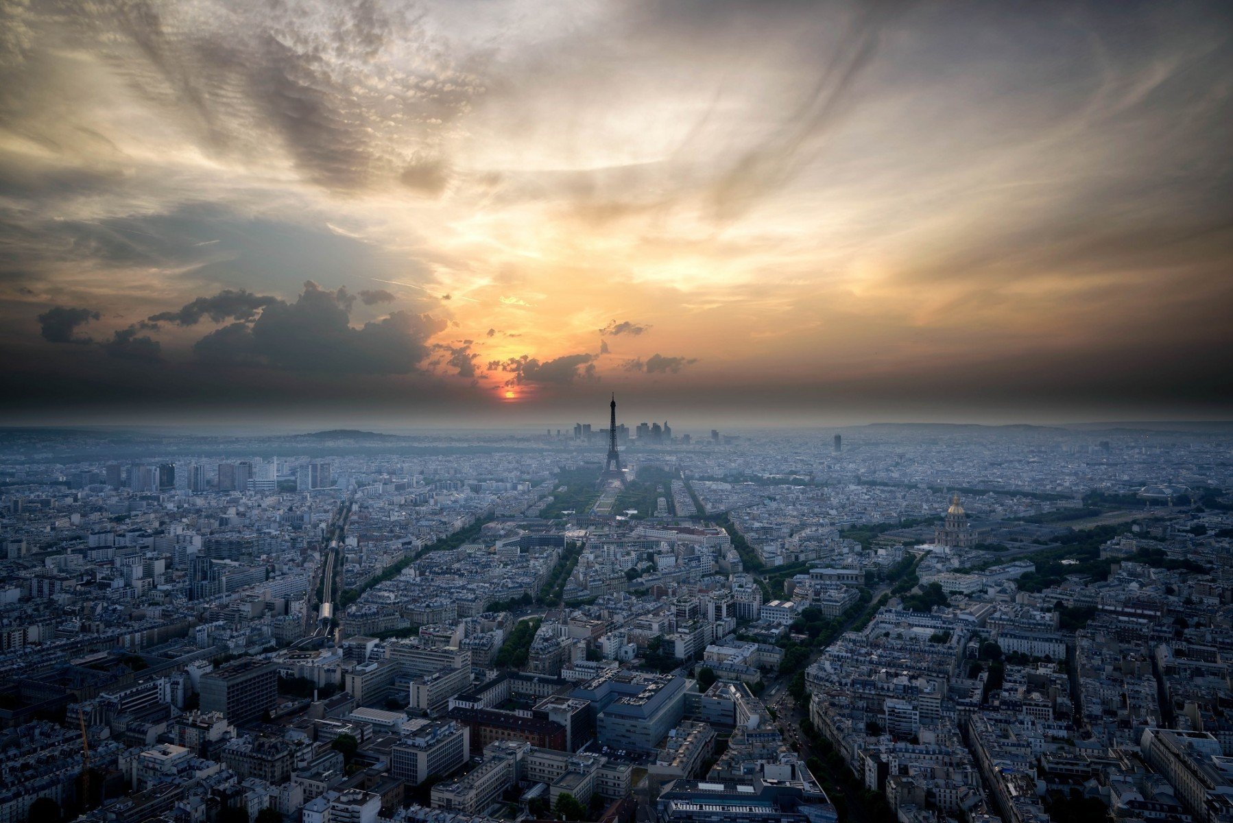 Panoramic view of Paris at sunset from Montparnasse Tower near Académie hotel