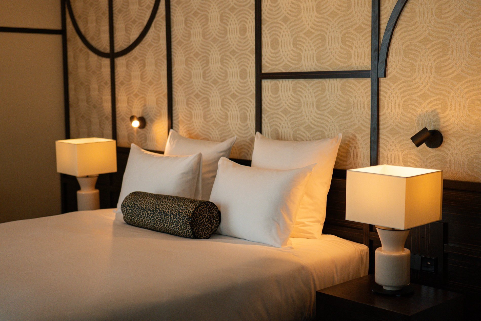 Art Deco hotel room in Paris with double bed, designer lamps and intimate atmosphere at Maison Cassandre