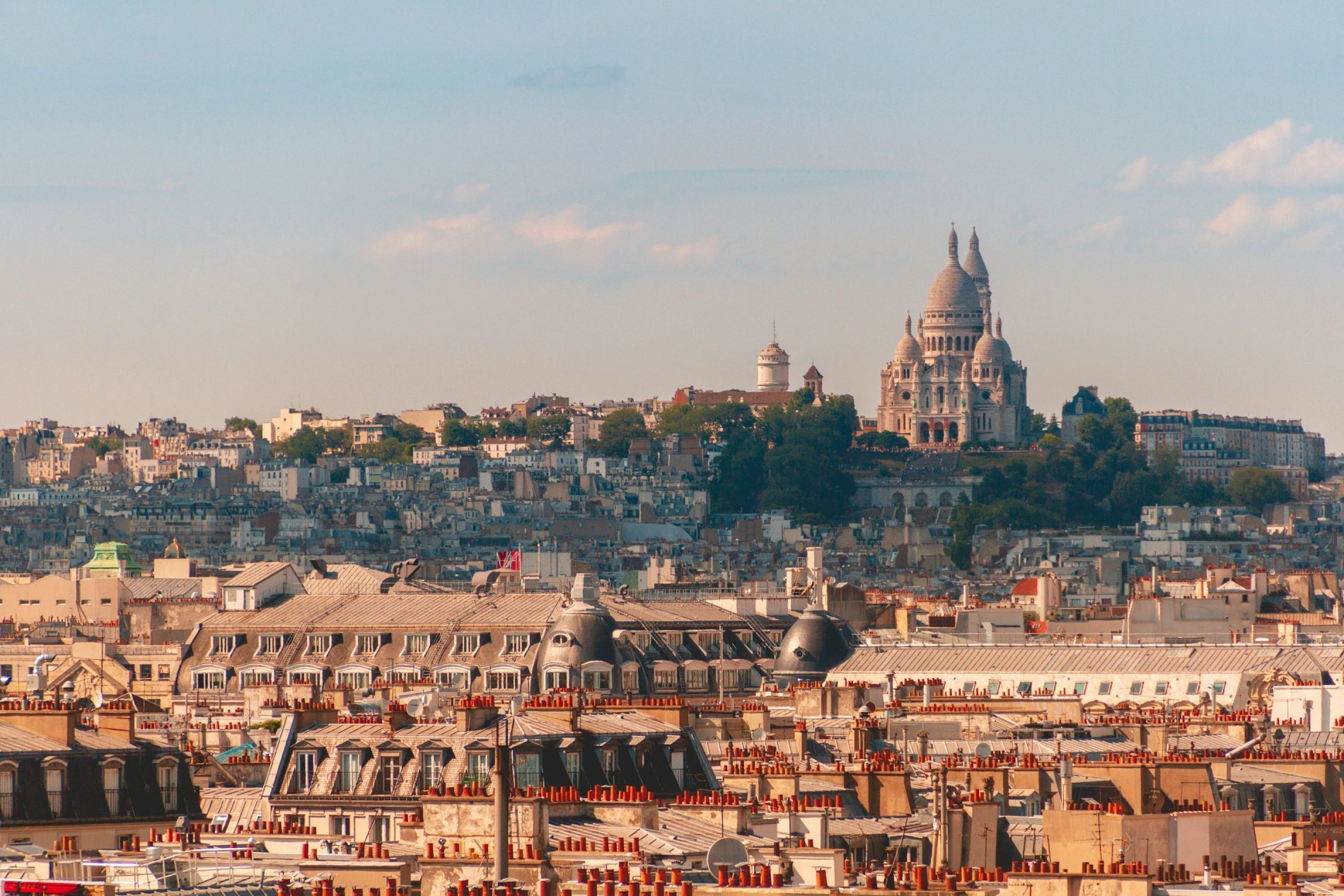 Sacré-Cœur dominating the Paris rooftops, iconic view of the City of Lights.
