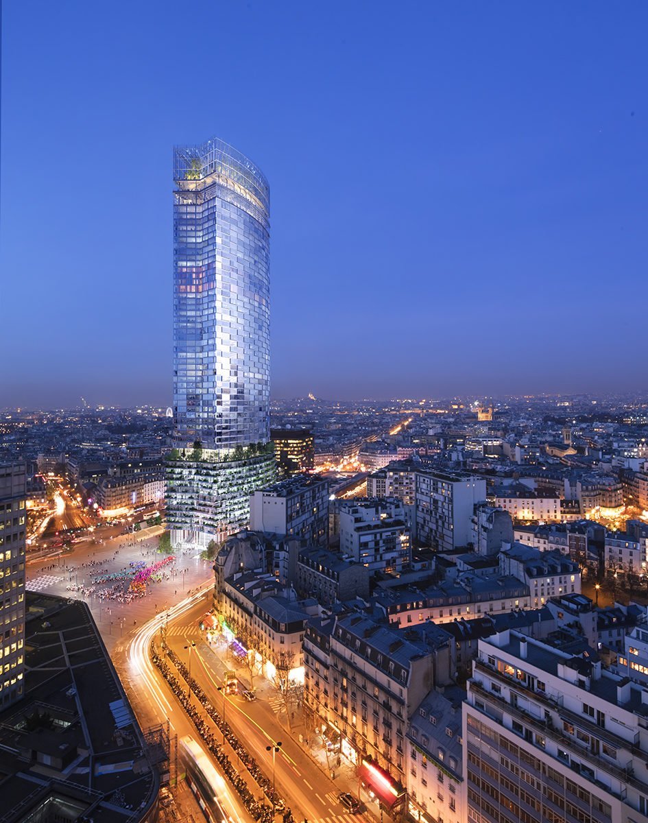 The Montparnasse Tower, located in the heart of the city, dominates the urban landscape with its imposing height. Night scene.