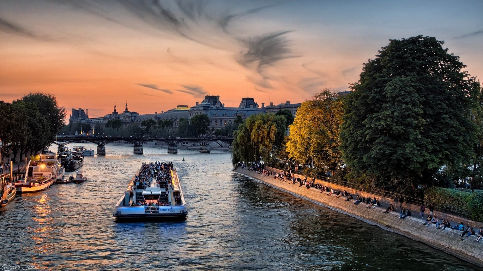 Seine river cruise at sunset with a view of Paris near Académie hotel