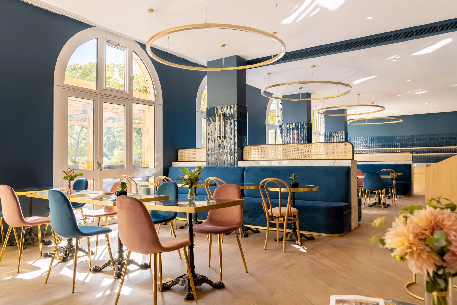 View of the elegant dining room of the restaurant at VOCO Paris Montparnasse with ambient lighting.