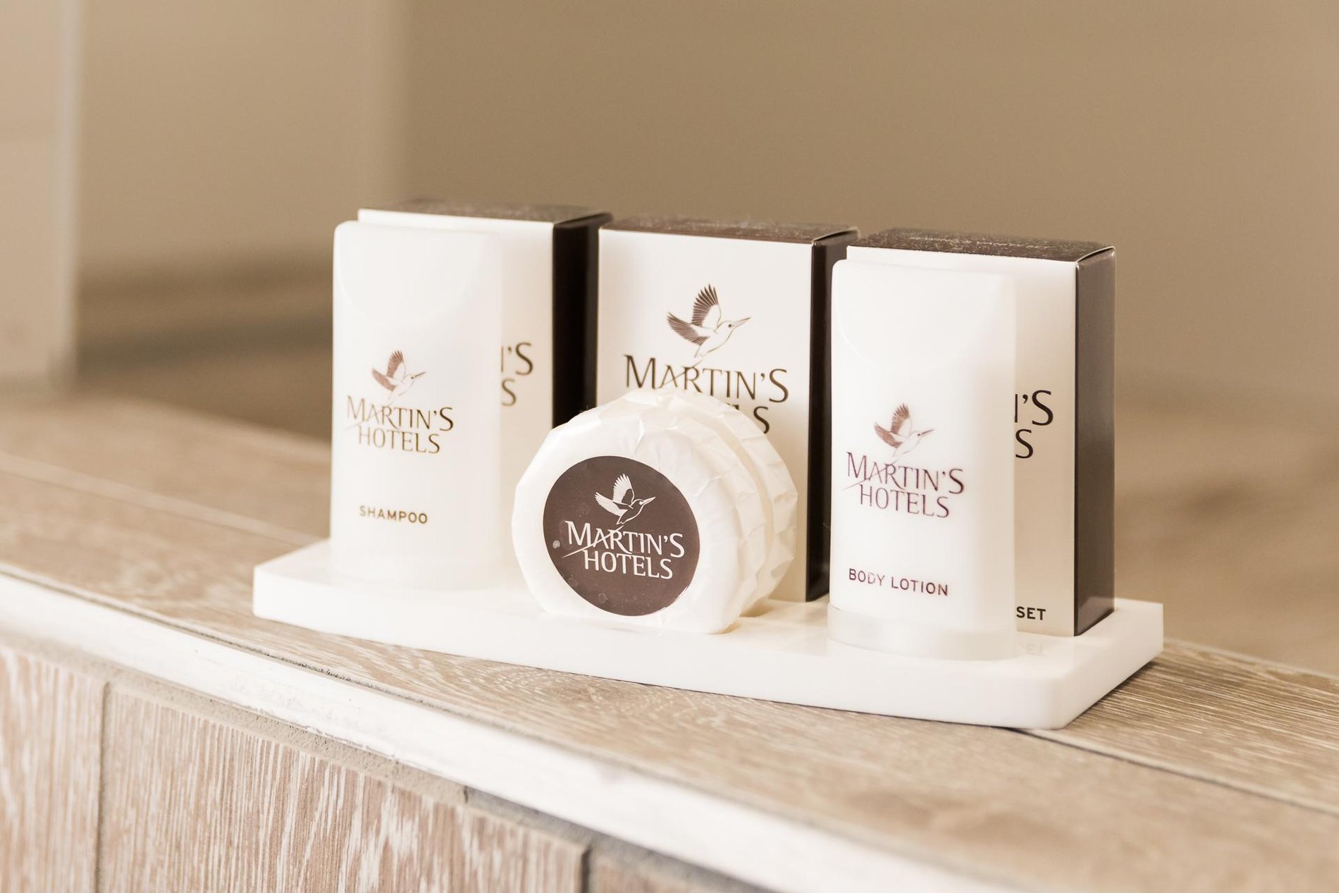 Elegant Martin's Hotels toiletries arranged in a bathroom.