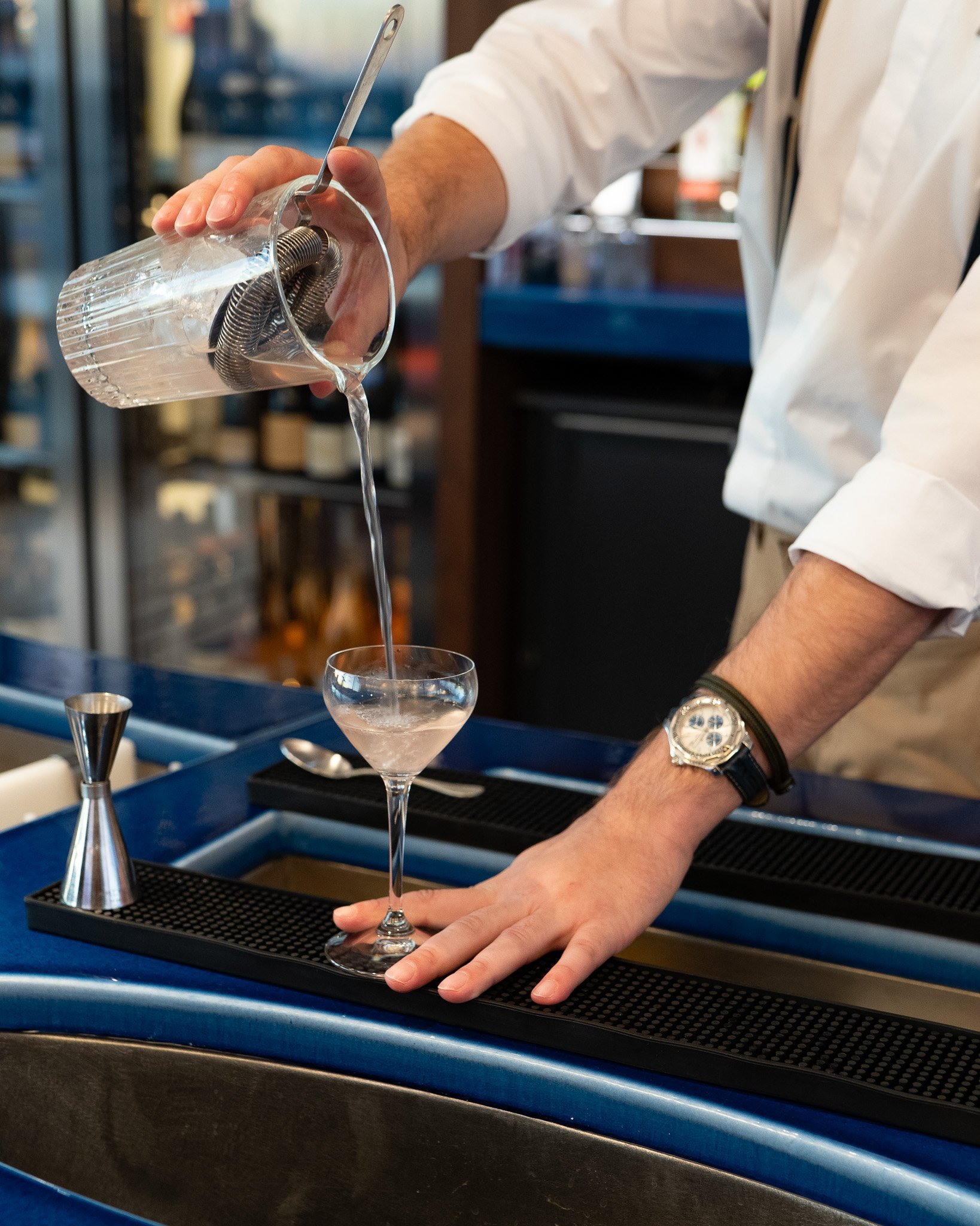 Bartender making a cocktail at Taulissa Bar.