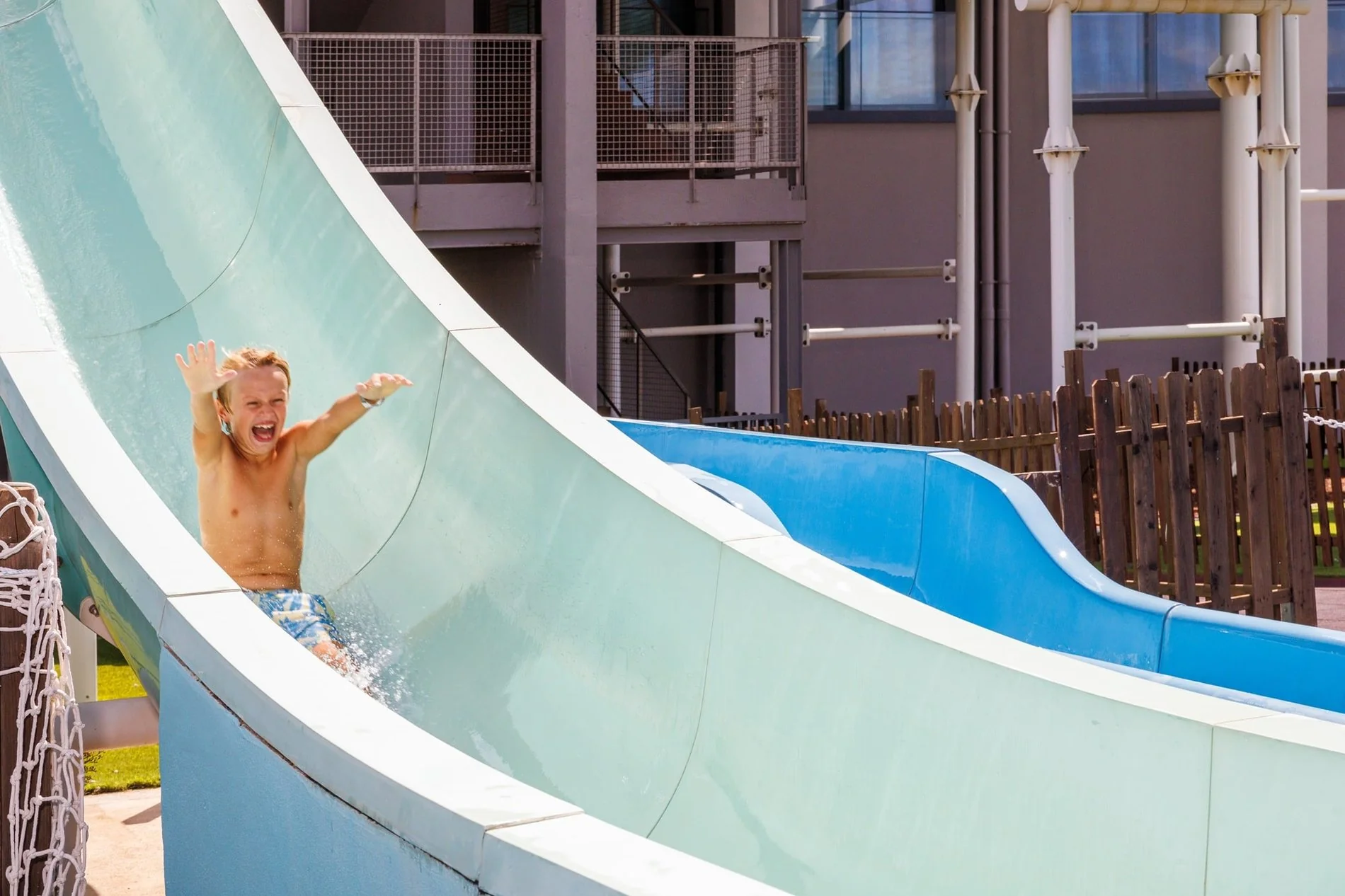 Child sliding on the slides of the Jupiter Albufeira Hotel