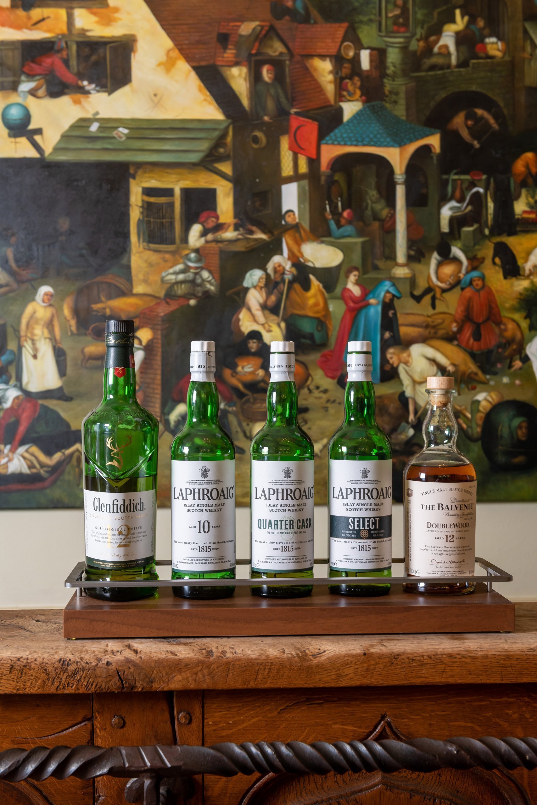 Collection of bottles in an artistic setting at Martin’s Relais Hotel.