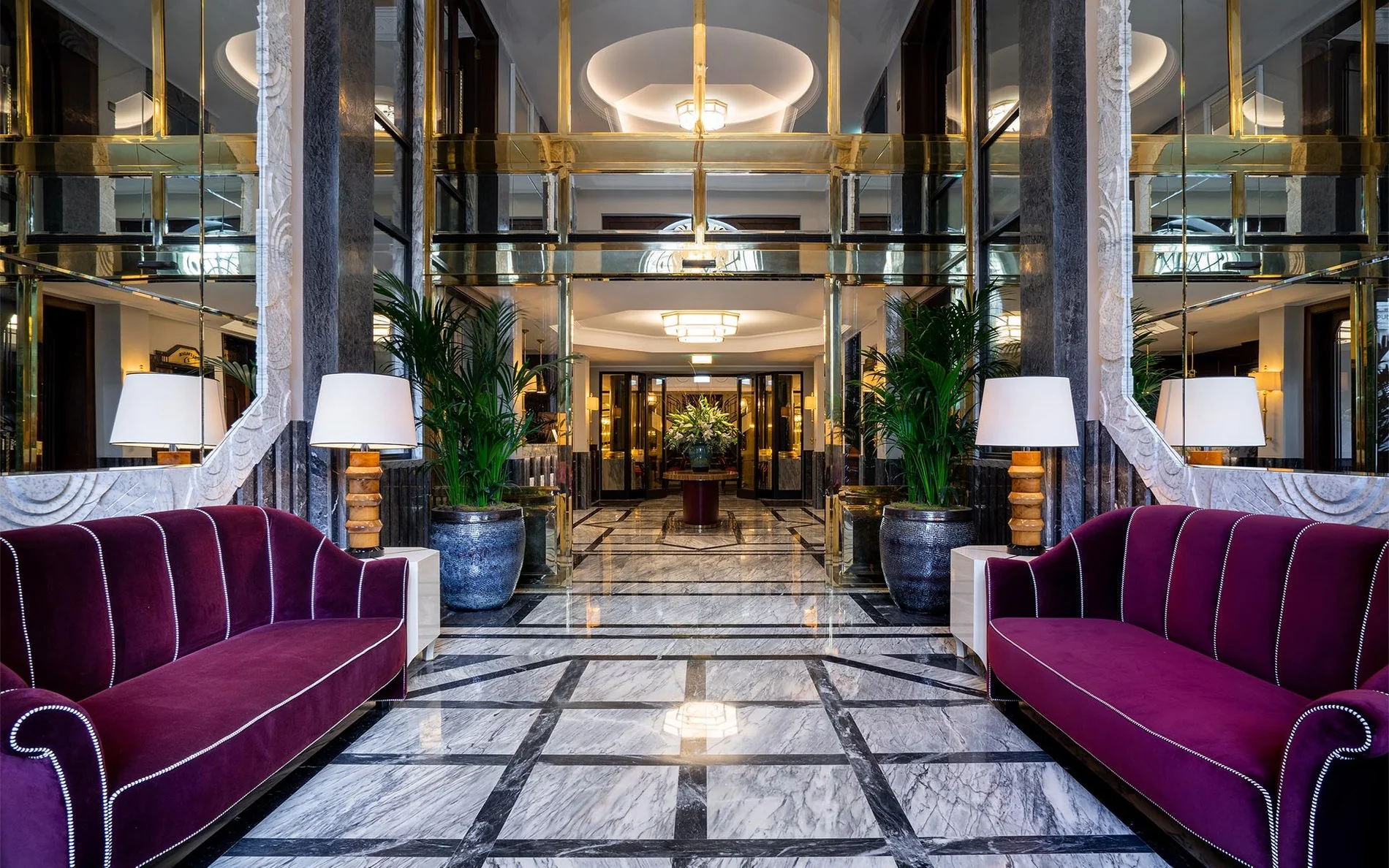 Luxurious lobby of Maison Albar - Le Monumental Palace in Porto, with marble floor and elegant lounge areas