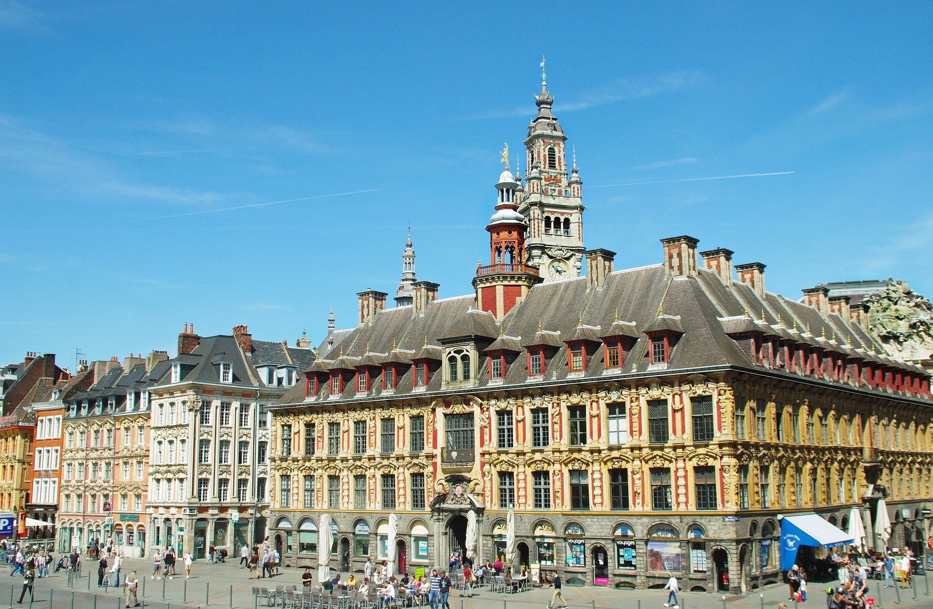 Facade of the Vieille Bourse under a blue sky, emblematic of Vieux Lille near the Art Deco Euralille hotel