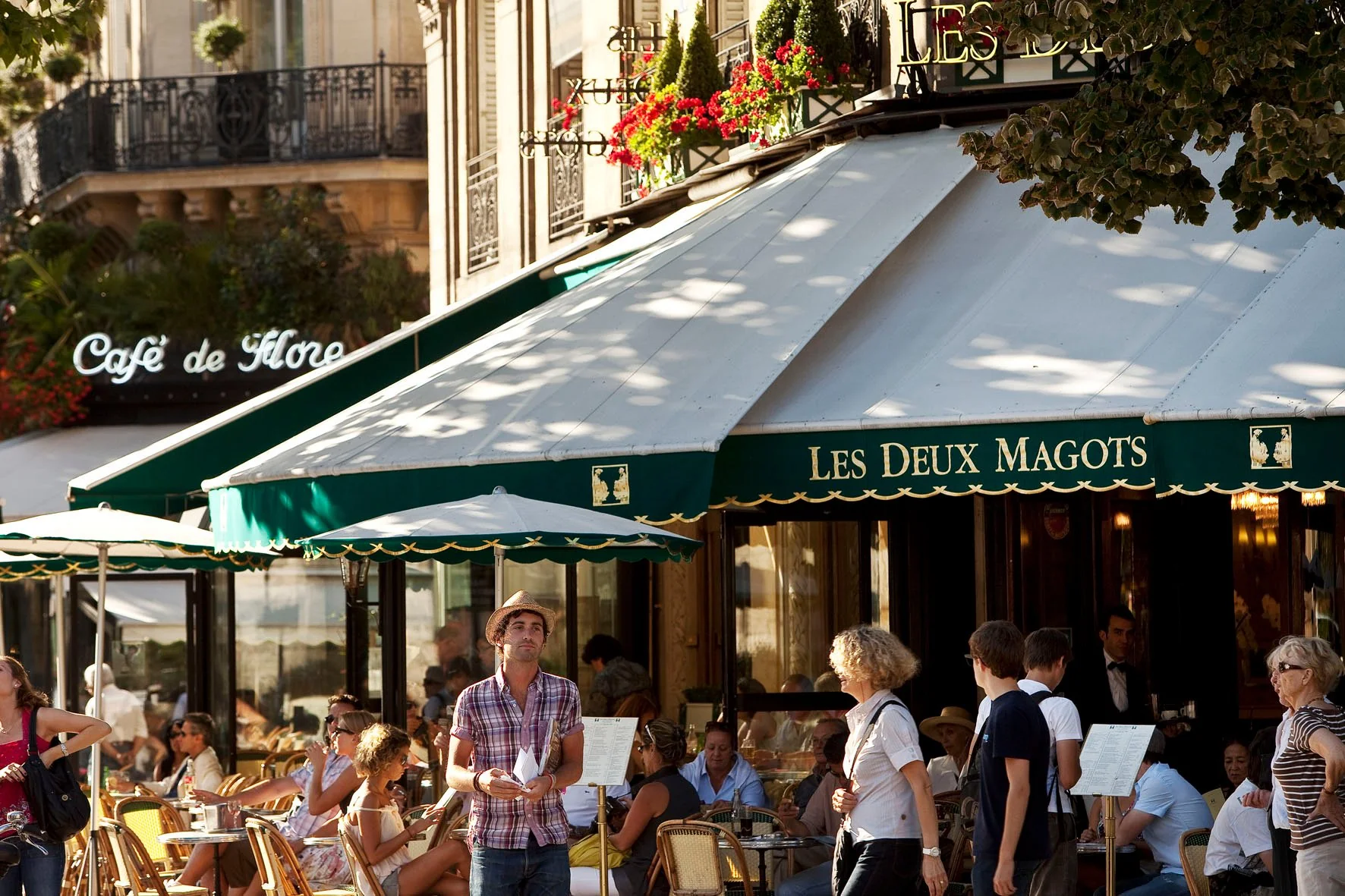 Lively terrace of Café de Flore and Les Deux Magots in Saint-Germain-des-Prés Paris
