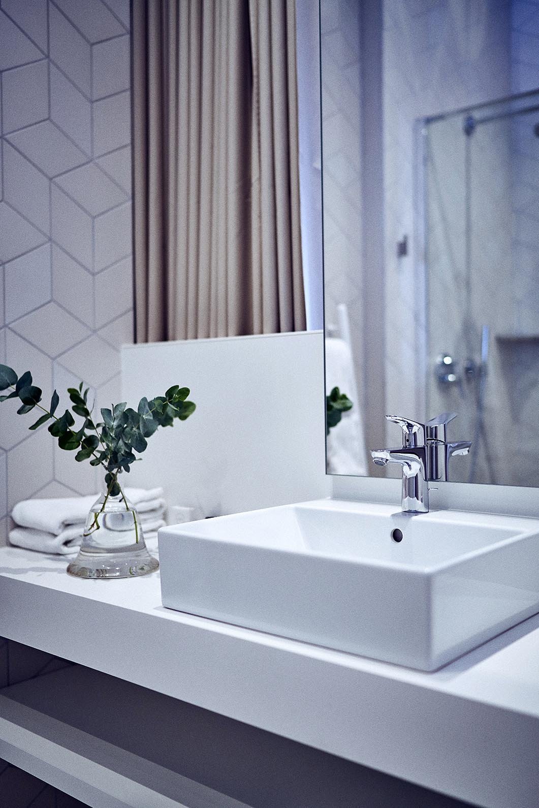 A bright, spacious 25m² Masterpiece room with an open-plan shower area and separate toilet.