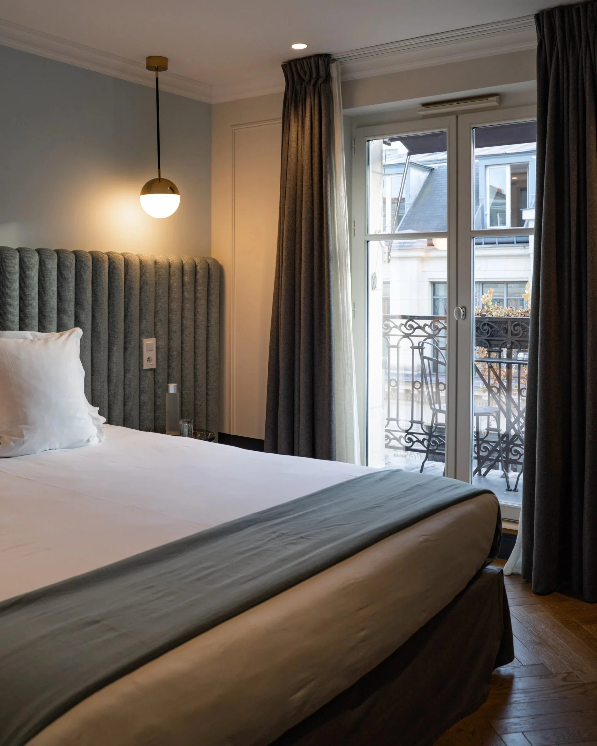 Hôtel Bachaumont | Bed and balcony in the Parisienne Suite