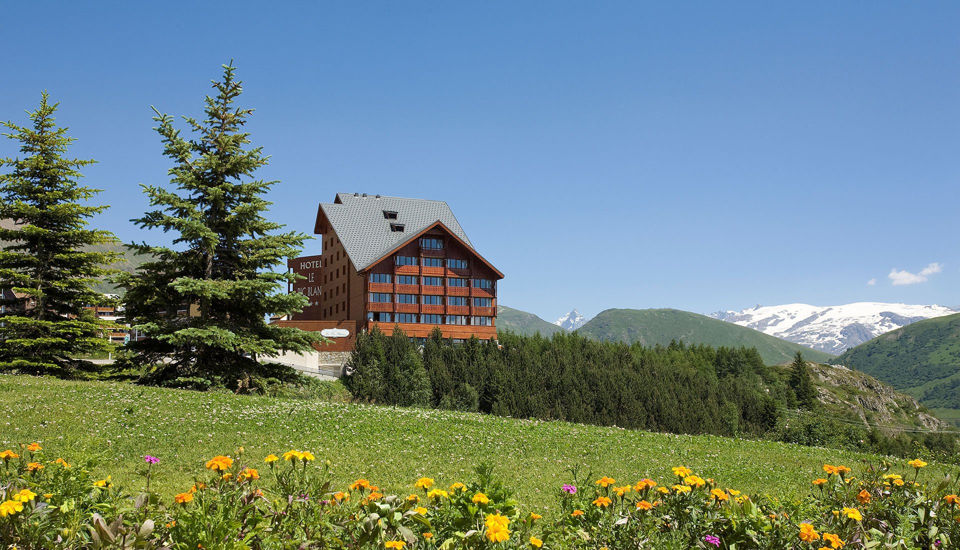 Summer view of the Hotel Pic Blanc in Alpe d'Huez