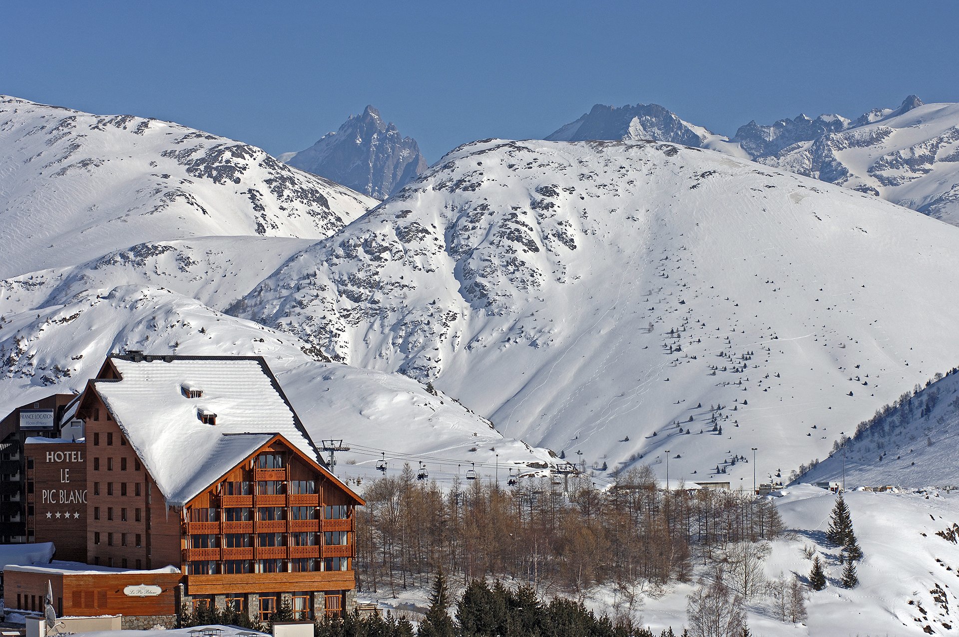 Summer view of the Hotel Pic Blanc in Alpe d'Huez