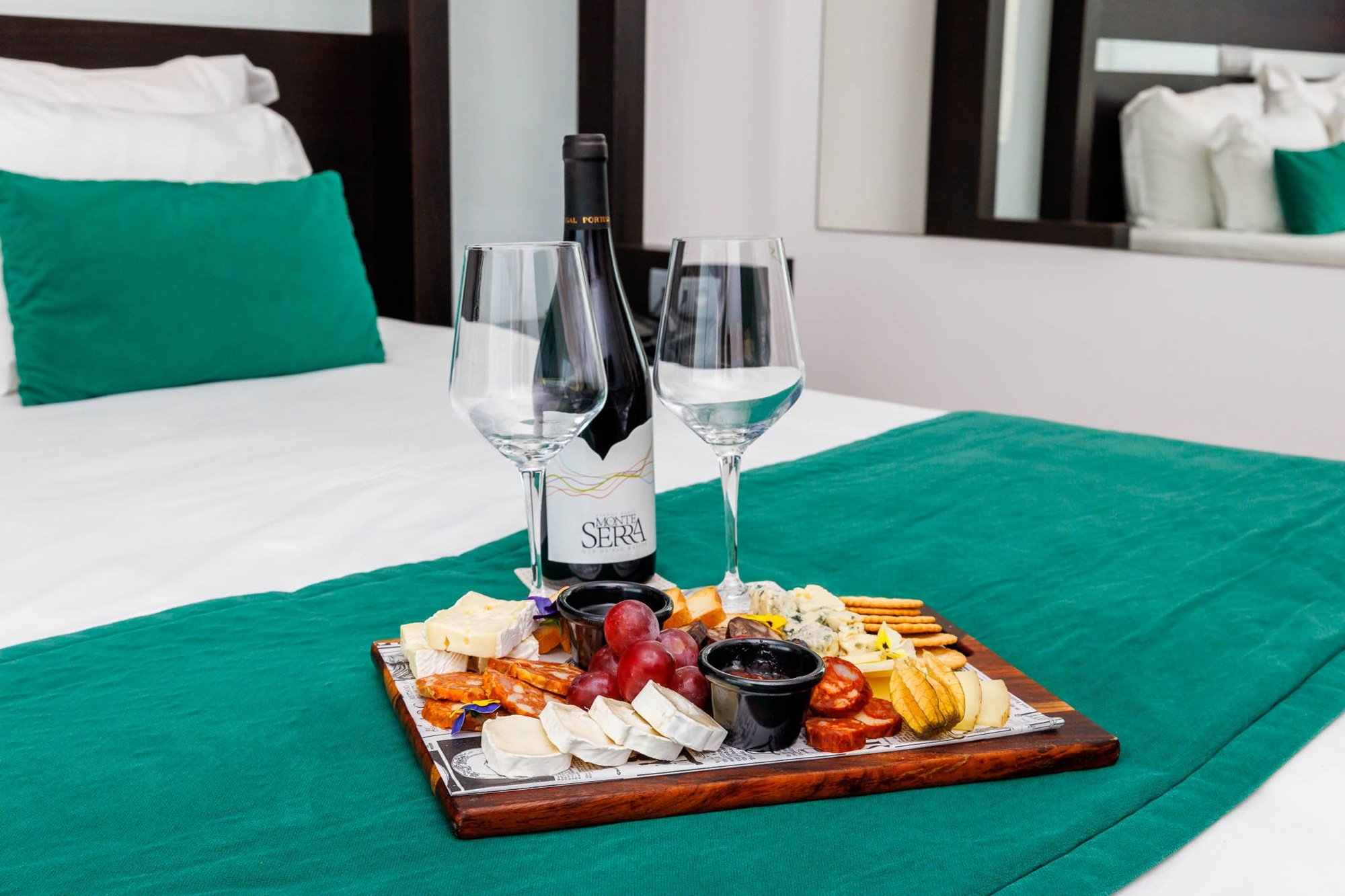 Enjoy a selection of cured meats accompanied by wine, designed to elevate your stay into an extraordinary gastronomic experience.